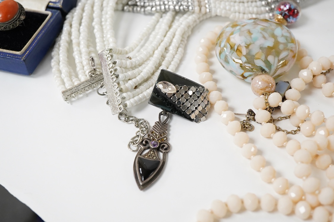 A collection of costume jewellery, including a pair of 9ct gold and garnet cluster set earrings, pair of yellow metal hoop earrings, graduated agate bead necklace, etc.